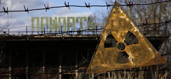 A radioactive sign hangs on barbed wire outside a café in Pripyat.